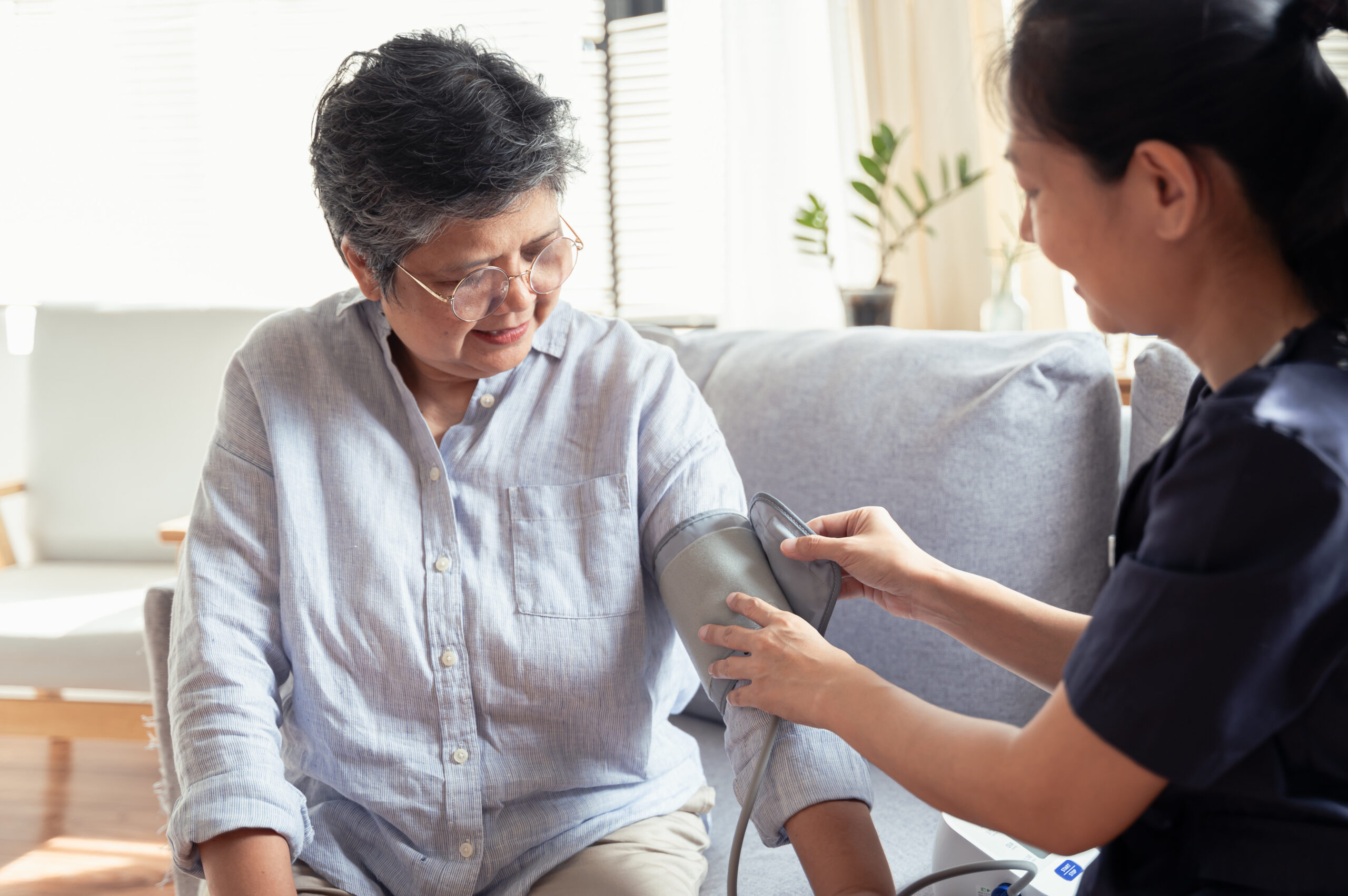 Nurse taking a patients blood pressure