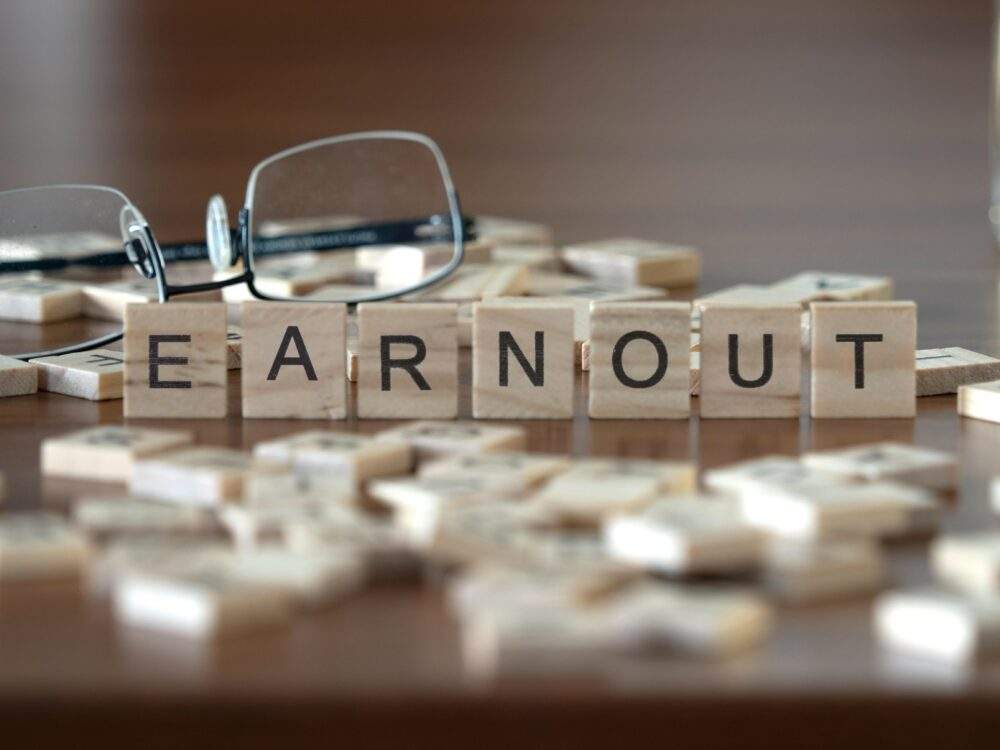 Earnout spelled out in Scrabble tiles